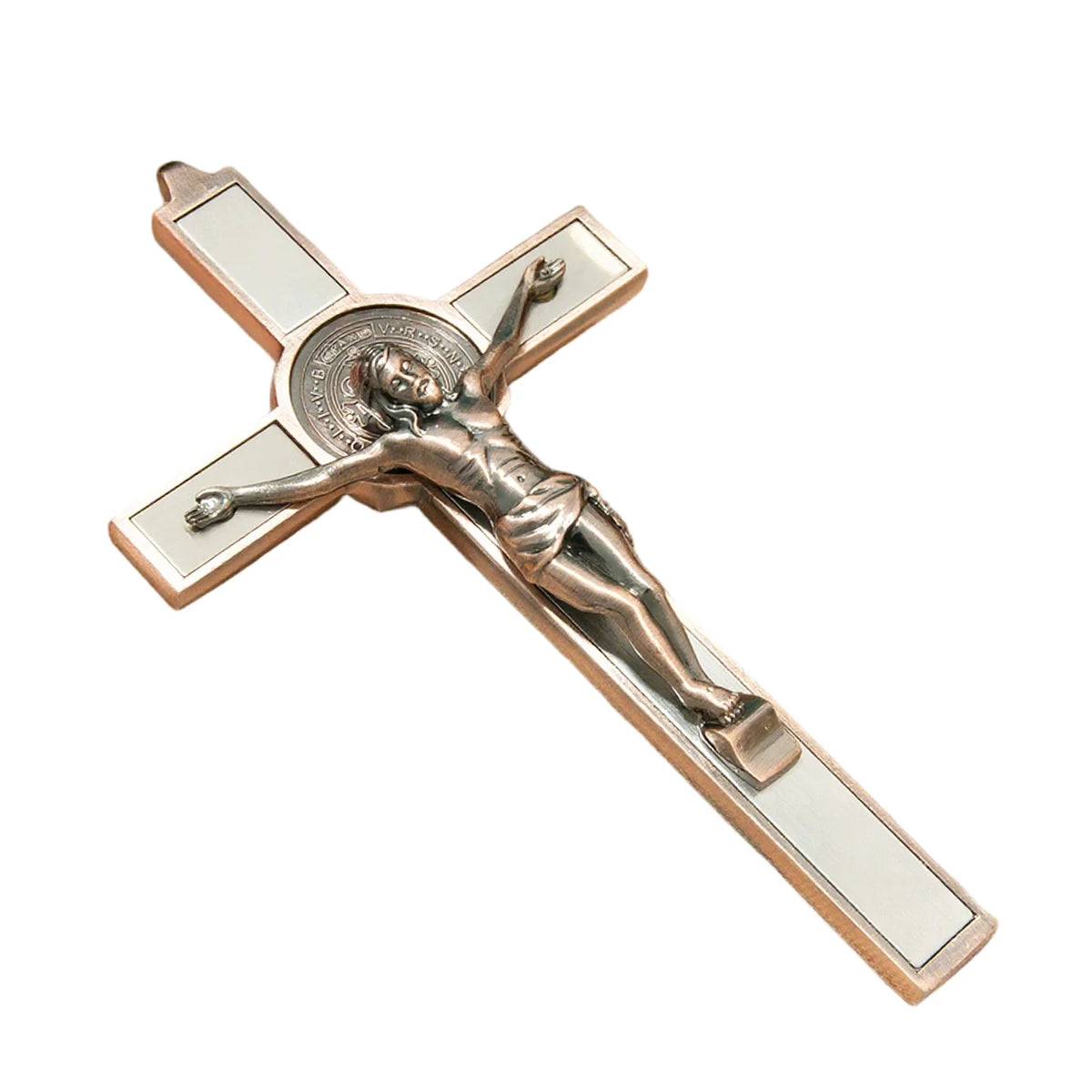 A silver-toned crucifix wall decor featuring a sculpted figure of Christ and a St. Benedict medal.