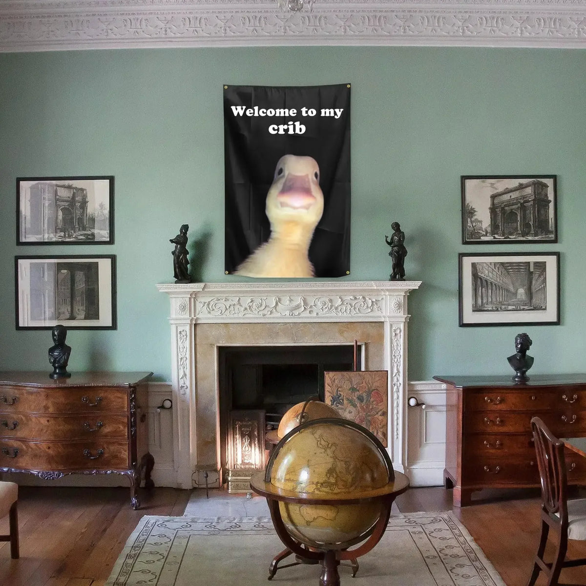 A decorative crib flag hangs on a dark background above a fireplace mantel in a room with wooden furniture and framed picture