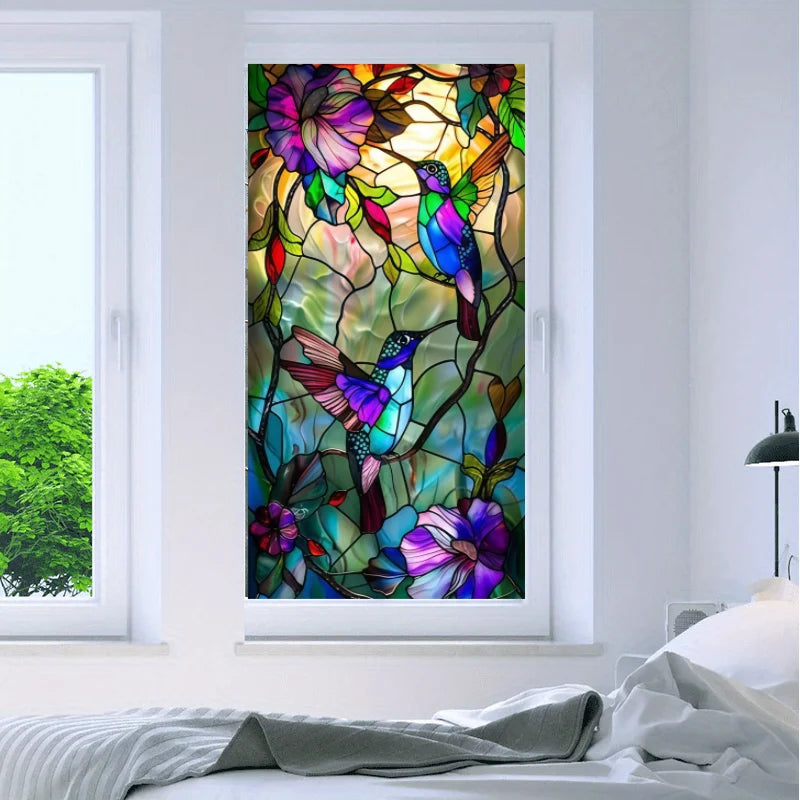A close-up of a stained glass window film featuring vibrant purple and green hummingbird floral designs.