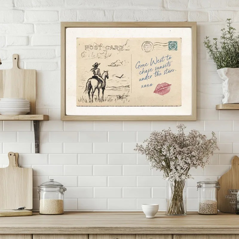 A framed vintage postcard print depicting a cowboy riding a horse in a western style.