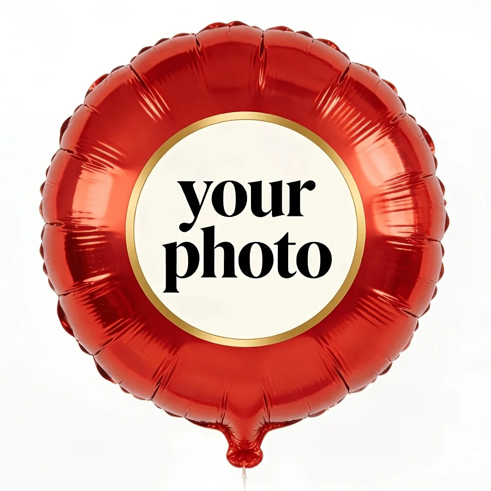 A red foil balloon shaped like a heart with a circular sticker that reads your photo