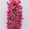 A vibrant hanging arrangement of pink and magenta faux bougainvillea vine flowers.