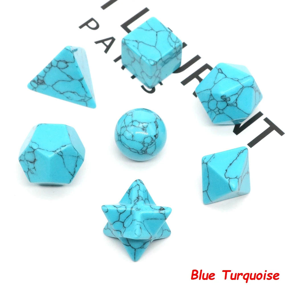 A set of various geometric crystal shapes in blue turquoise including a pyramid, cube, sphere, and star.