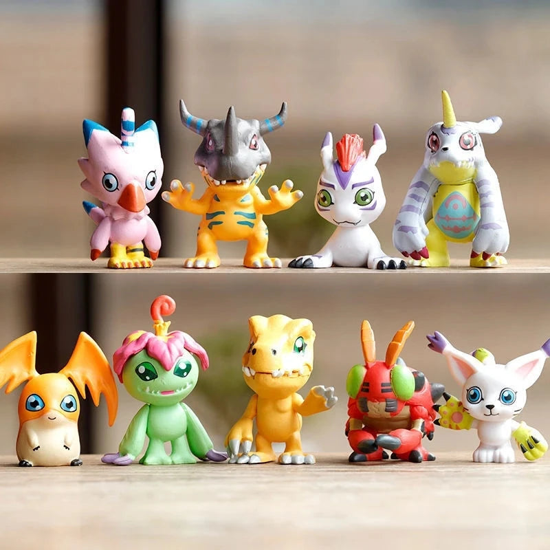 A collection of nine Digimon Adventure figures, including various monster designs and colors, displayed on a wooden surface.