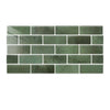 A rectangular mosaic of glossy, muted sage green peel-and-stick tile wall stickers.