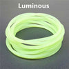 A coil of luminous, neon yellow silicone bracelets.
