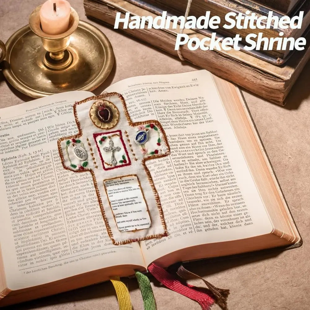 A handmade stitched pocket shrine featuring a silver cross on a leather-bound book.