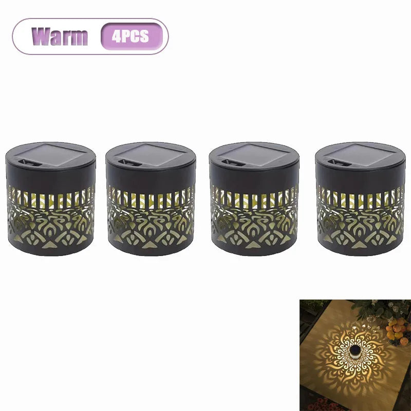 Four warm solar-powered mandala wall lanterns with gold accents for garden and patio lighting.