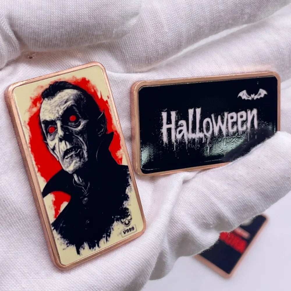 A rectangular bar of copper fantasy art with a protective case featuring the word Halloween on a black background.