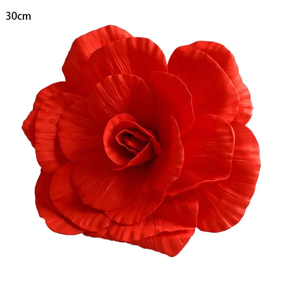 A vibrant red silk foam rose flower with layered petals.