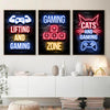 Three framed canvas art prints featuring neon alphabet text on a dark background related to gaming and cats