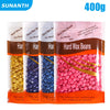 Pack of hard wax beans for body hair removal in various colors like yellow, blue, and pink.