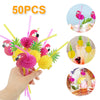 A hand holds a bundle of 50 pink and yellow tropical 3D flamingo and pineapple paper straws.