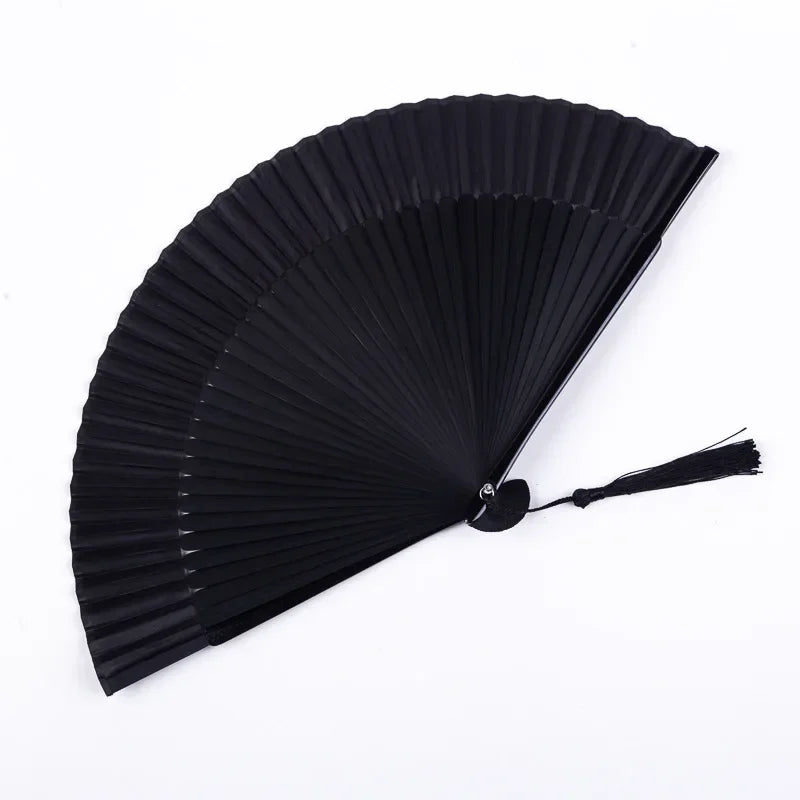A black traditional Chinese folding fan with pleated ribs, shown open and angled.