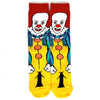 A pair of novelty crew socks featuring skull, alien, and tiger prints on a yellow background.