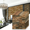 A close-up view of stacked 3D foam brick wallpaper panels in earthy brown and gray tones.