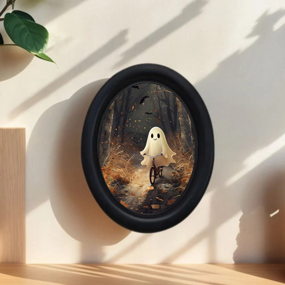 Oval wooden wall art depicting a white ghost riding a bicycle through a dark forest scene.