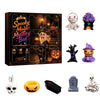 A box of a Spooky Magic Mystery Box featuring various Halloween-themed resin figurines and accessories.