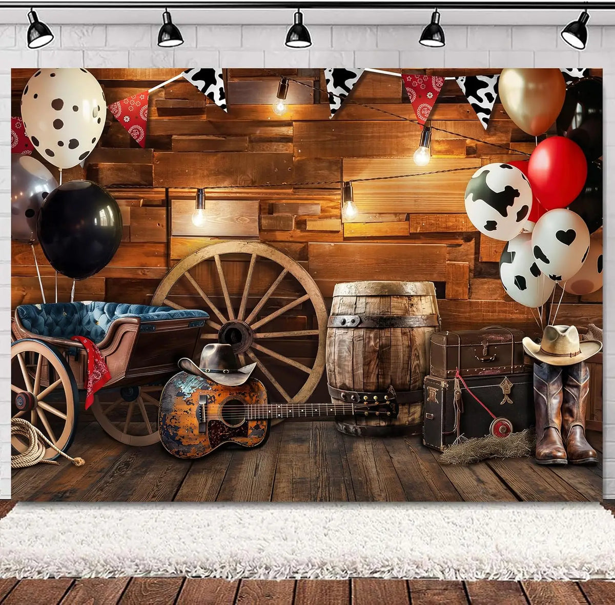A rustic western backdrop featuring a wooden barn door, vintage wagon wheel, guitar, barrel, and balloons.