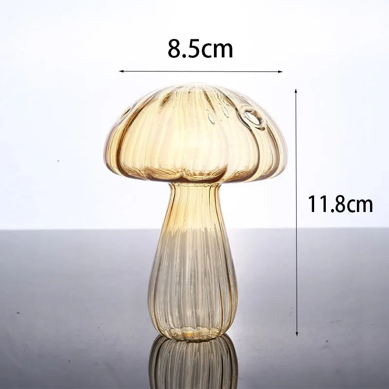 A clear glass vase shaped like a mushroom with translucent jelly colors, shown from the top and side.