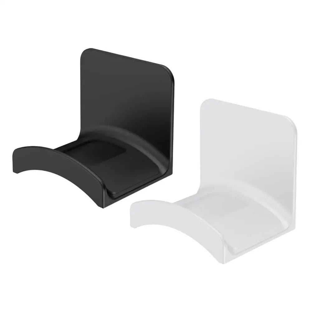 A pair of universal wall-mounted headphone holders, one black and one white.