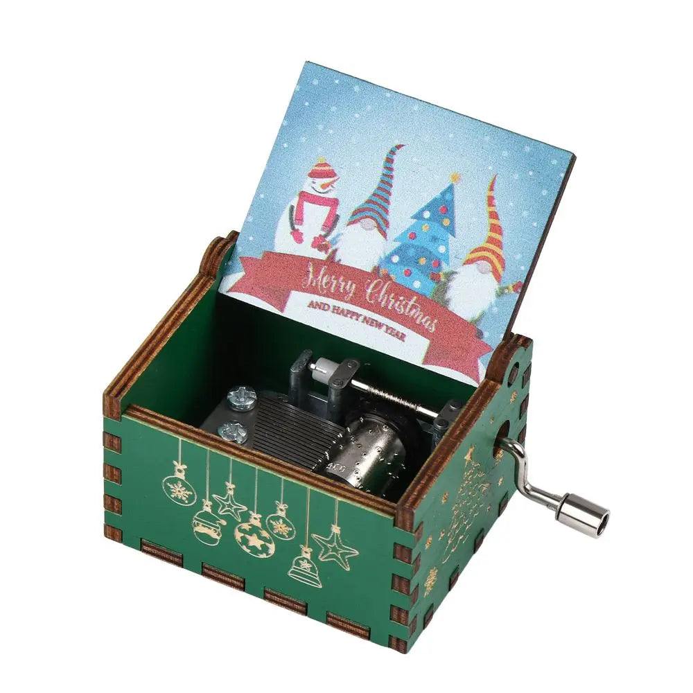 A vintage hand-cranked wooden music box with a green wooden box and a festive Christmas-themed lid.