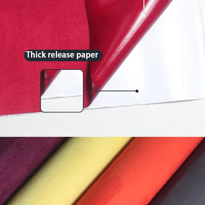 A close-up view of thick release paper used for a self-adhesive suede wrap fabric.