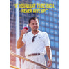 A man in a white polo shirt and trousers holds a glass of red wine while standing on a railing.