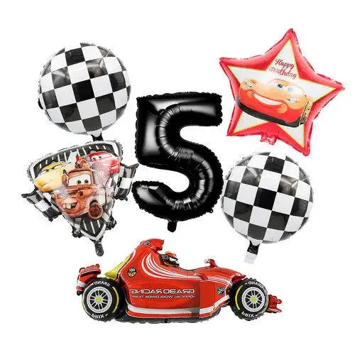 A set of birthday racing car party decorations including a black number five balloon, a red star balloon, and a racing car cu