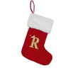 A red Christmas stocking with a white fluffy cuff featuring a gold letter R embroidered on it.