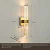 Modern bubble crystal and aluminum alloy LED wall sconce with a brass finish mounted on a wall.