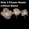 Three large, sheer, light gray velvet mesh flower heads without bases for wedding decoration.