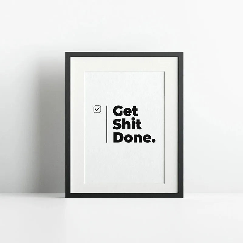 Black framed canvas wall art with the text Get Shit Done.
