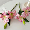 Three stems of pink and white artificial lilies with buds for home and event decor