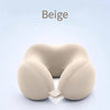 A beige U-shaped memory foam neck pillow shown against a light blue background.