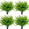 Four arrangements of vibrant green artificial Boston ferns and faux shrubs for home decor