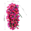 A vertical arrangement of vibrant pink and purple artificial bougainvillea flowers used for home or wedding decor.