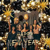 Five women pose in front of a black and gold balloon garland arch with starburst accents.