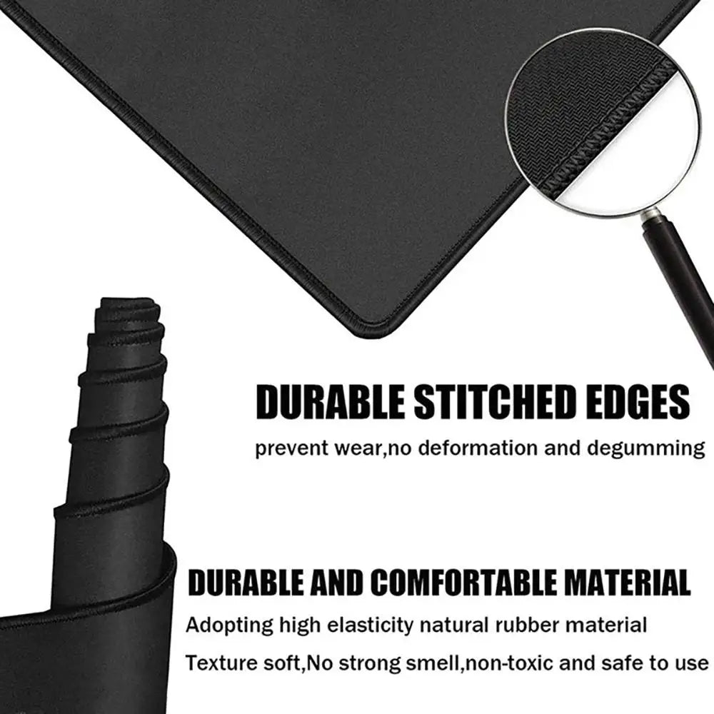 Black non-slip gaming mouse pad with durable stitched edges and soft natural rubber material