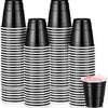 A set of black and white striped mini plastic shot cups for parties and events.