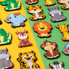 A collection of ten colorful cartoon animal fridge magnets featuring lions, tigers, monkeys, and other cute creatures.