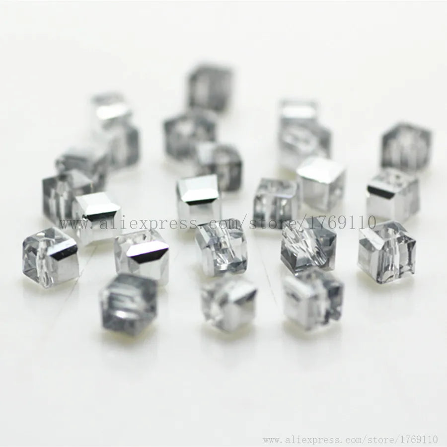 A collection of clear square cut glass crystal beads for jewelry making