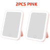 Two pink touch screen LED vanity mirrors displayed side by side.