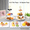 A set of decorative food trays including 2 three-tier and 3 square trays for serving