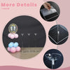 A set of clear acrylic balloon stands with balloons on a wooden table.