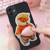 A hand holds a black smartphone displaying a soft pink 3D Shiba Inu squishy sticker decal.