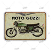 Vintage metal garage sign featuring a classic Moto Guzzi motorcycle silhouette and an eagle emblem.