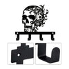 Black iron skull wall hook with floral accent and mounting brackets