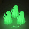 A pack of three glowing lime green ghost figurines with playful poses.