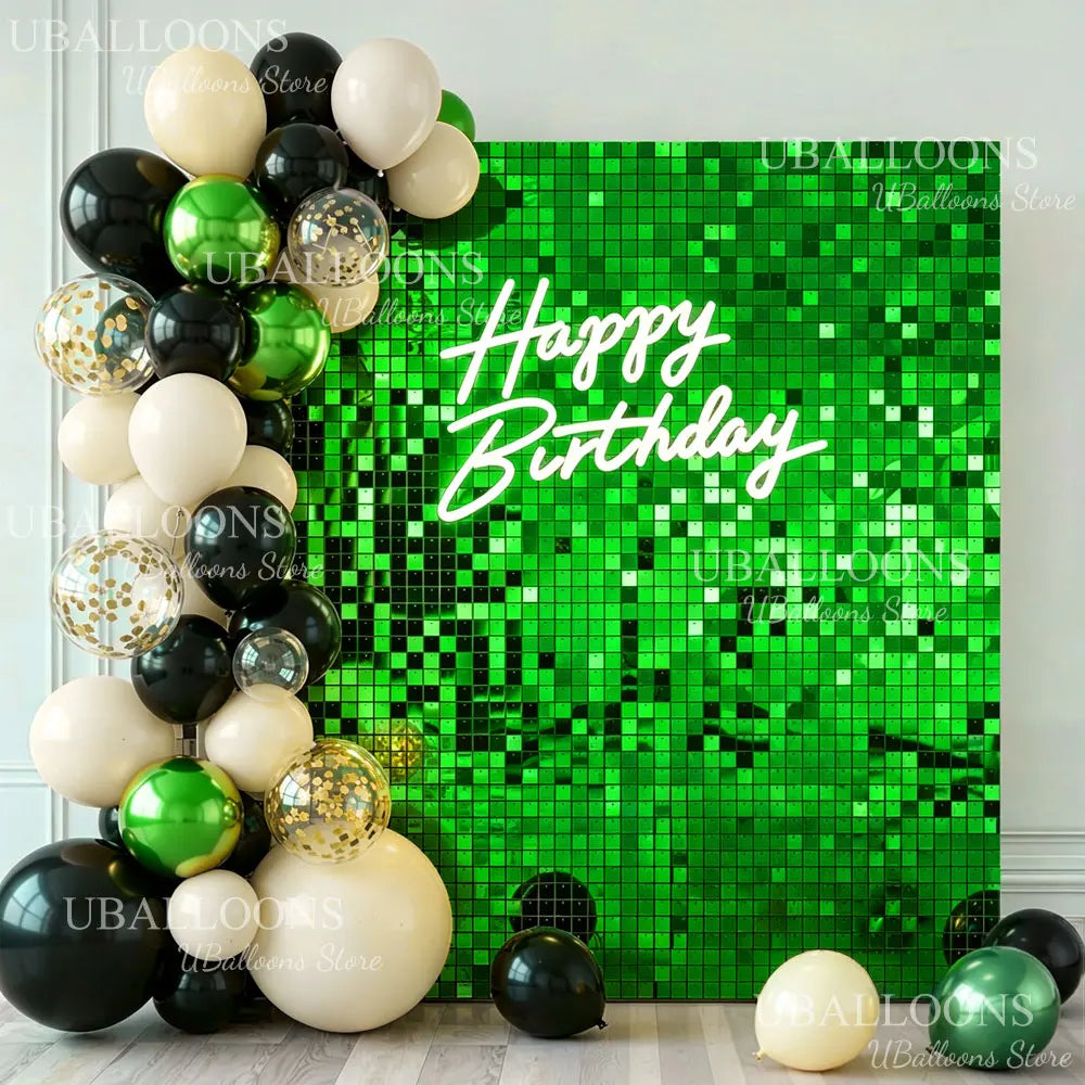 A vibrant green sequin wall backdrop decorated with clusters of gold, black, and lime green balloons for a birthday party.